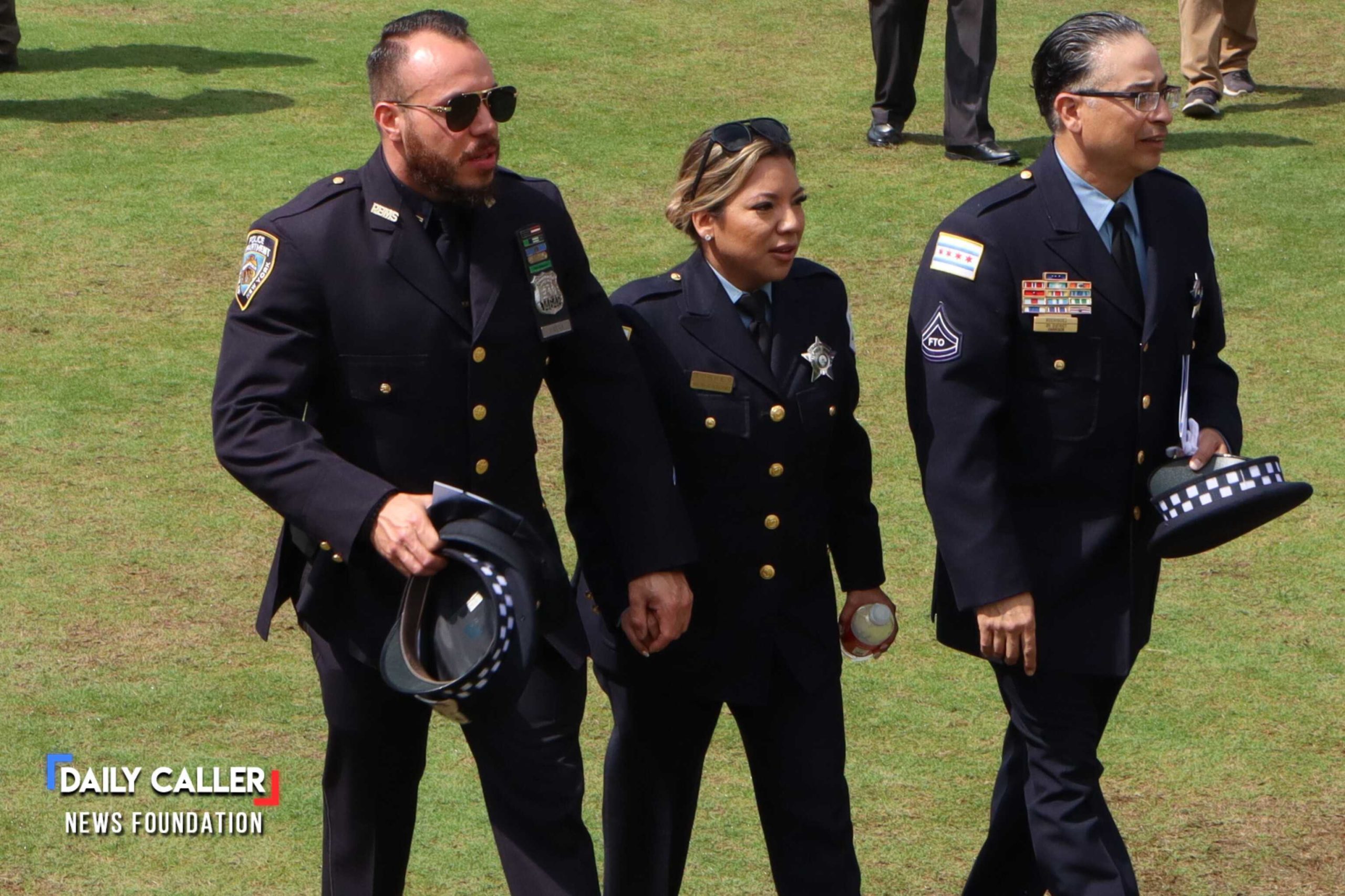 A couple in police uniform walk the U.S. Capitol Grounds at the National Peace Officers' Memorial Service on May 15, 2025 in Washington, D.C. 
