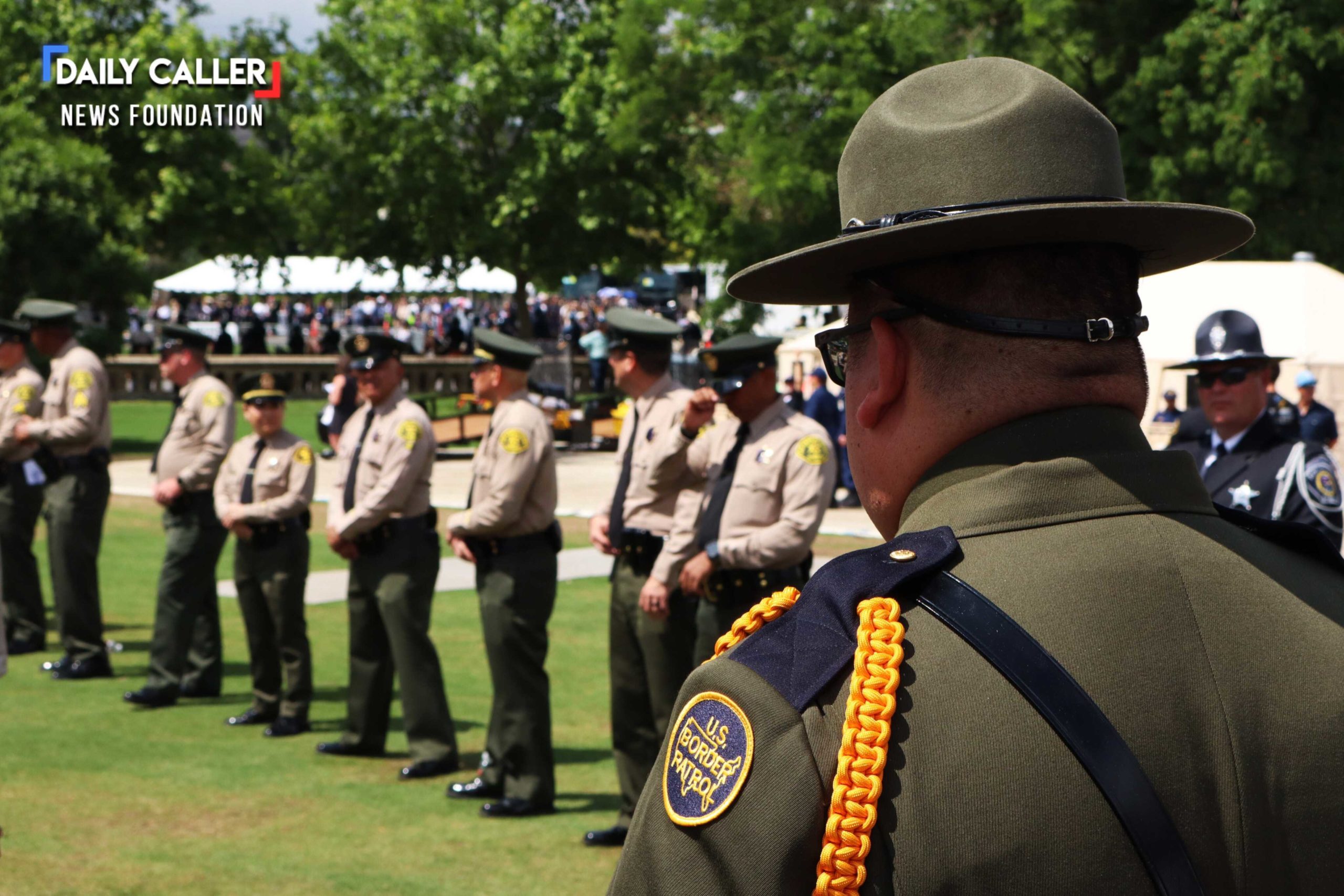A U.S. Border patrol agent stands with other law enforcement officers preparing to greet guests at the National Peace Officers' Memorial Service on May 15, 2025 in Washington, D.C.