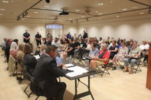crowded meeting of Hays Public Library board